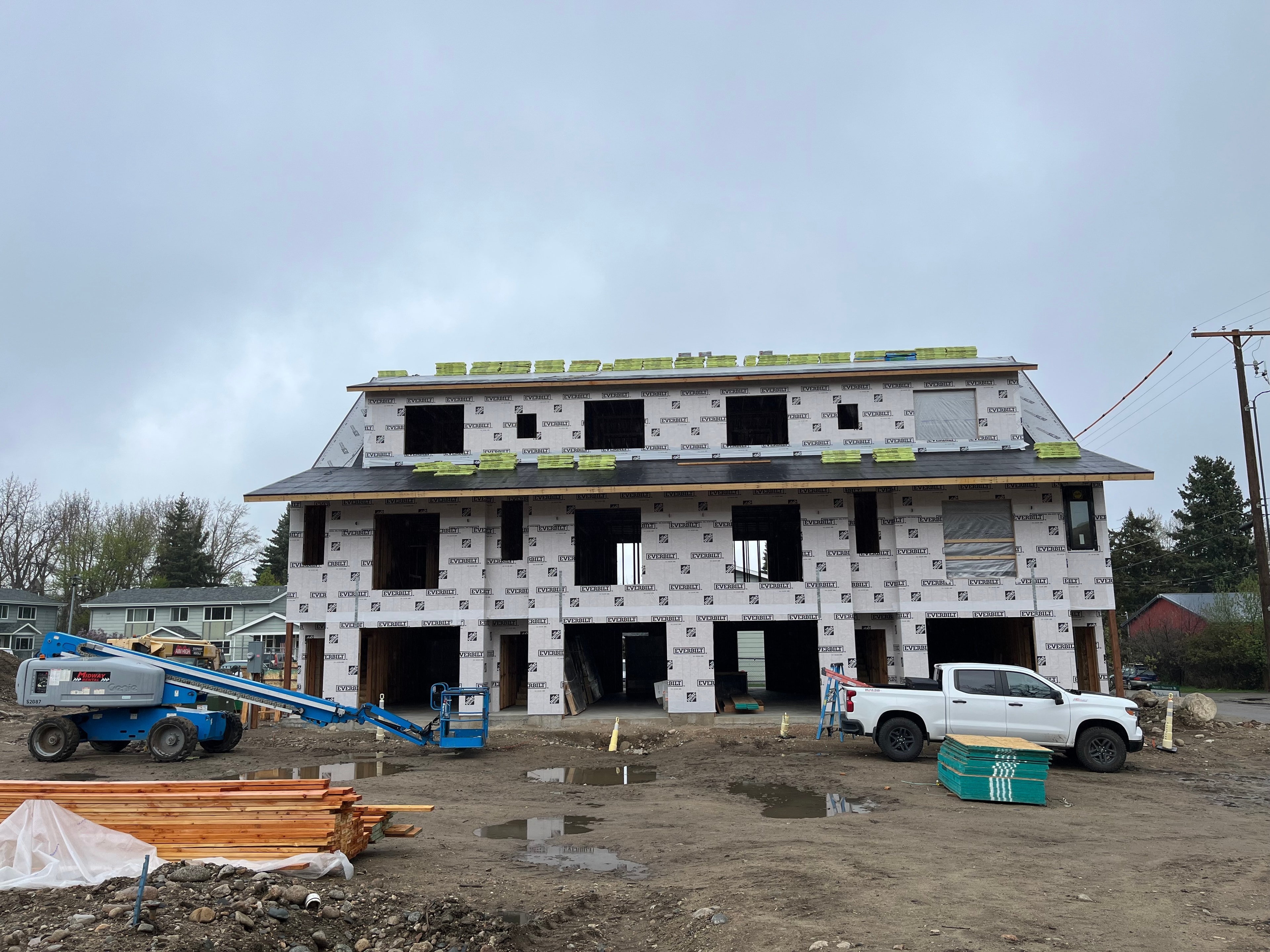 Electrician working on electrical rough-in at a new home construction site